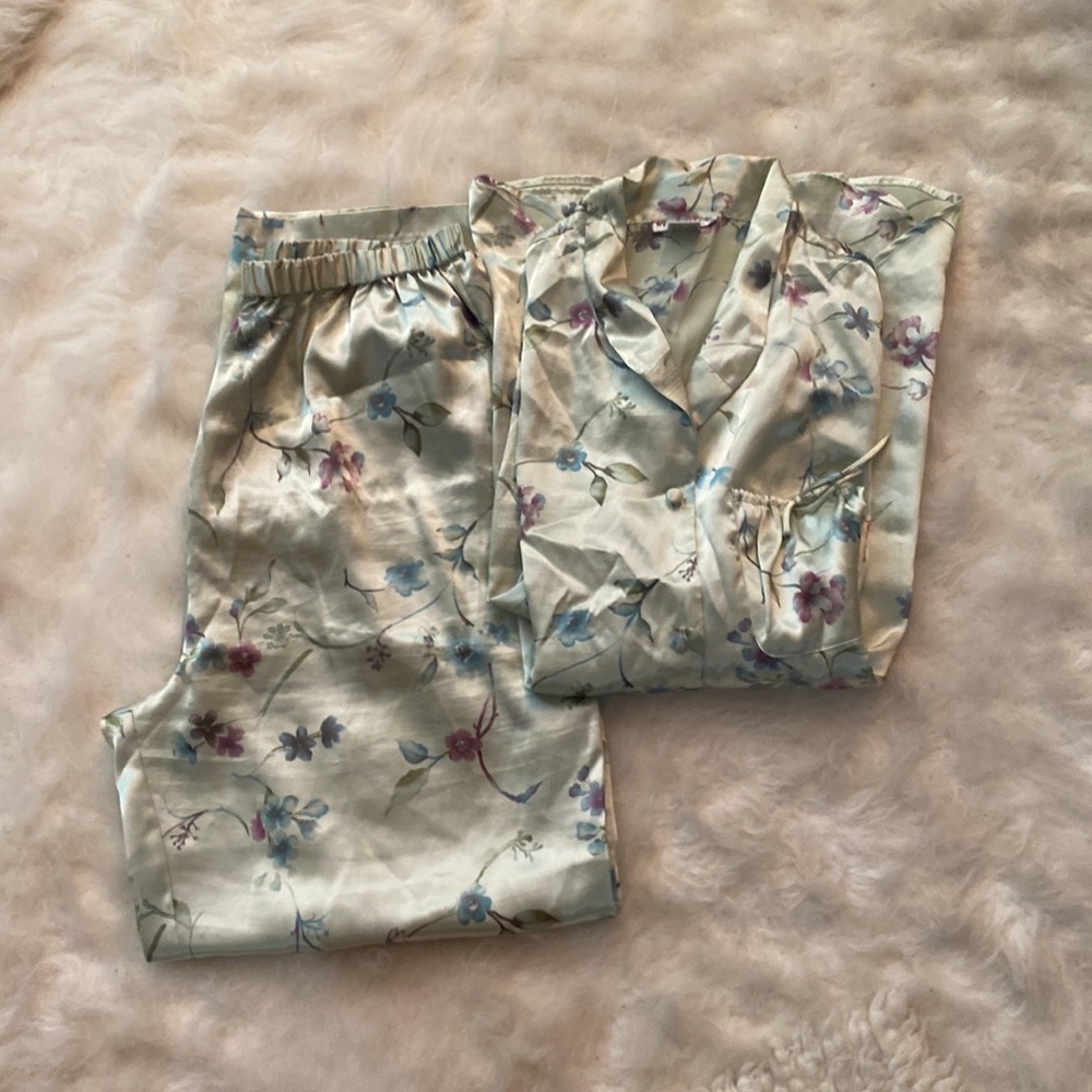 Two-Piece Pajama Set. Button down top and elastic waist pants. 100% Polyester